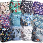 Stack of colorful washable cloth nappies with cute prints and adjustable buttons.