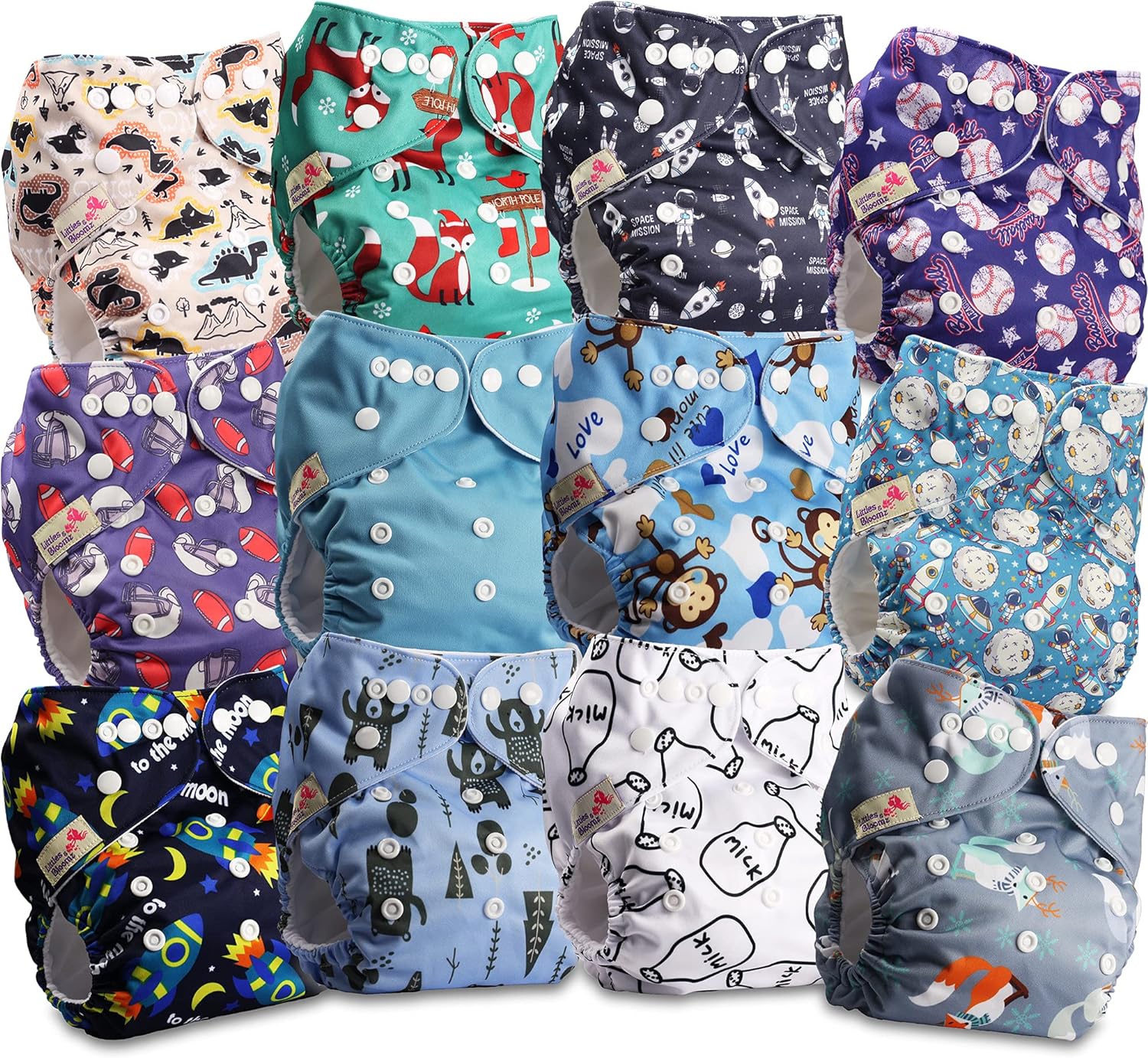 Stack of colorful washable cloth nappies with cute prints and adjustable buttons.