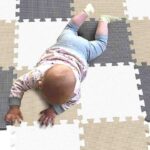 Baby lying on the perfect non-toxic foam mat for babies playing