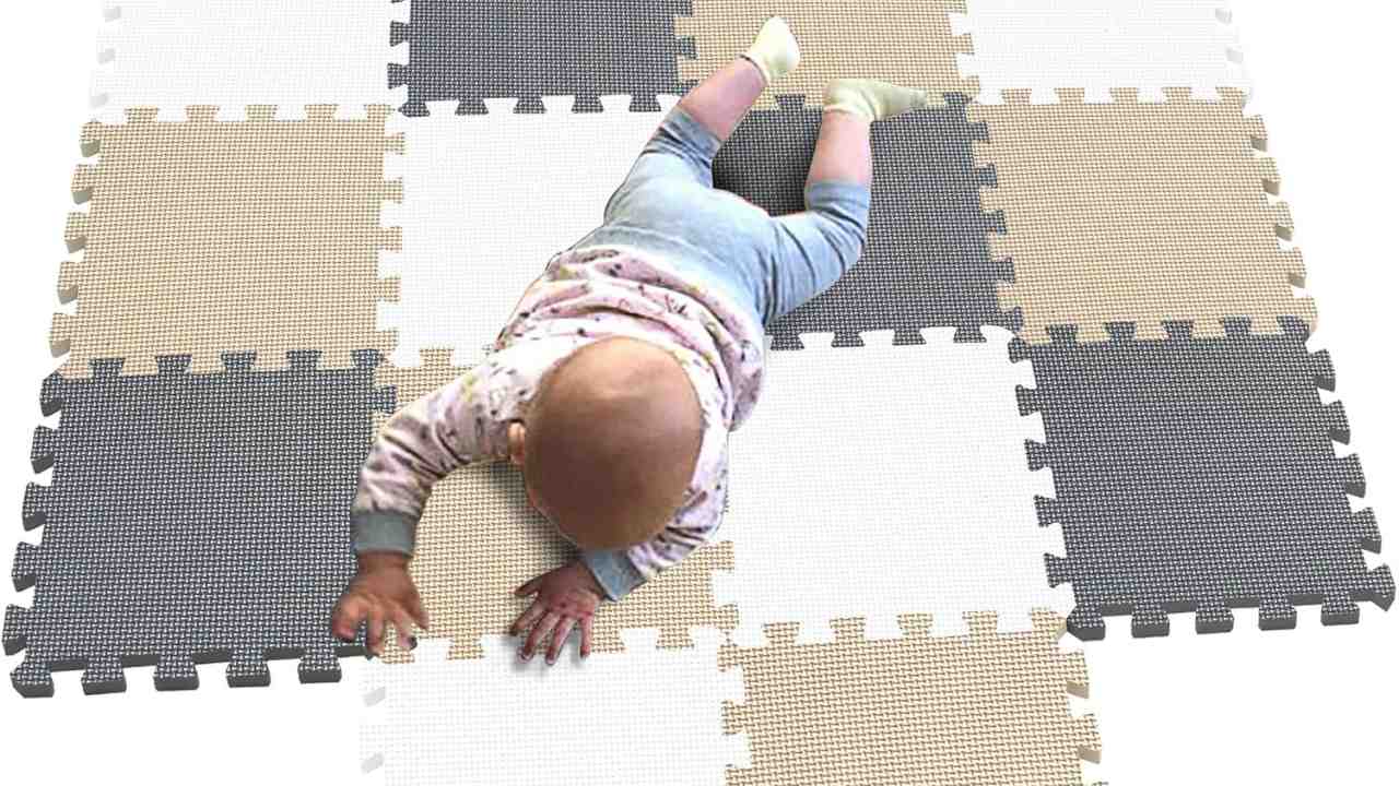 Baby lying on the perfect non-toxic foam mat for babies playing